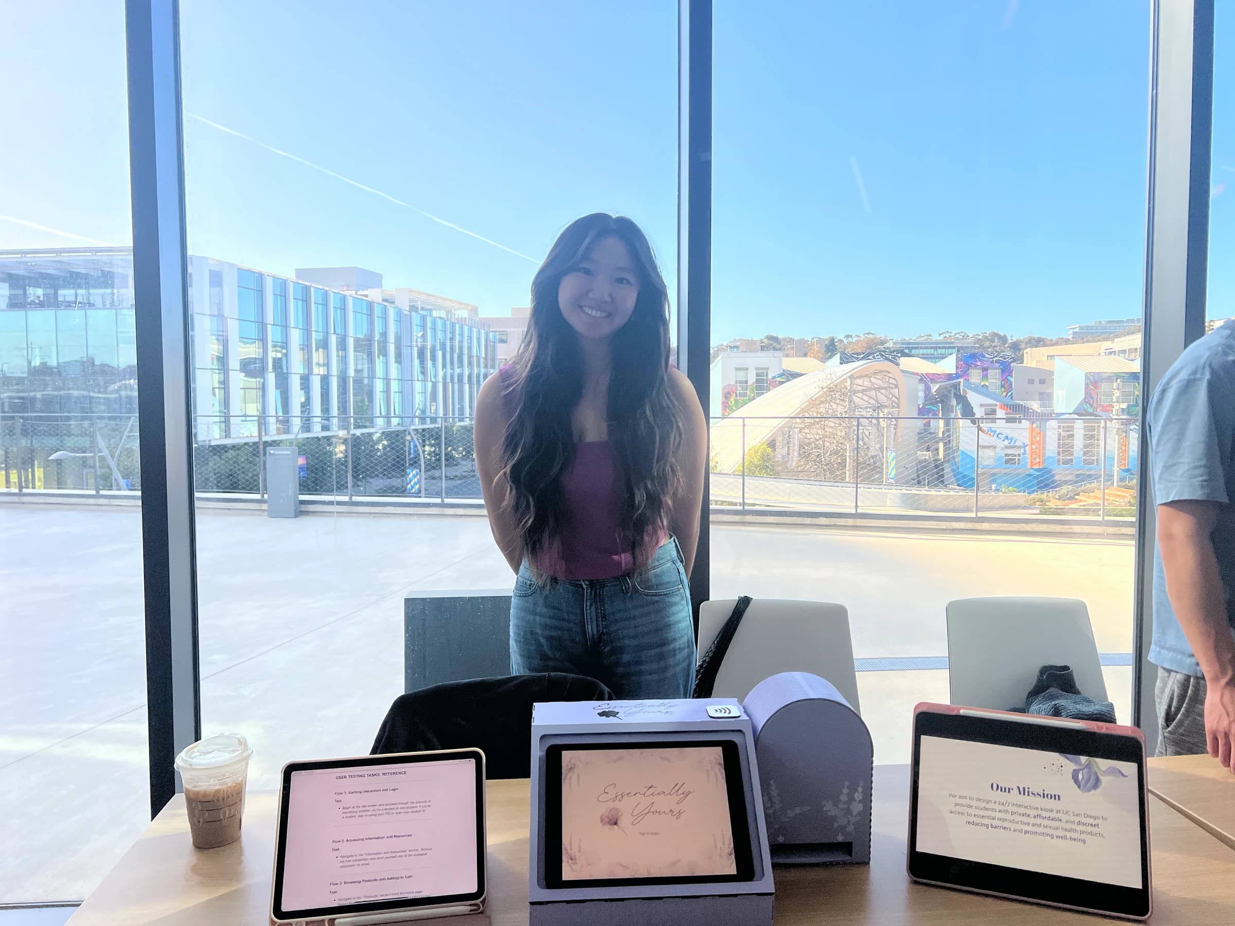 Marisa presenting the kiosk and tablet interfaces.